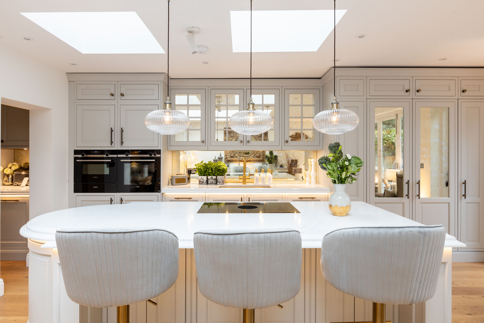 Bespoke Kitchen design in Cobham with central marble island and cream cabinets
