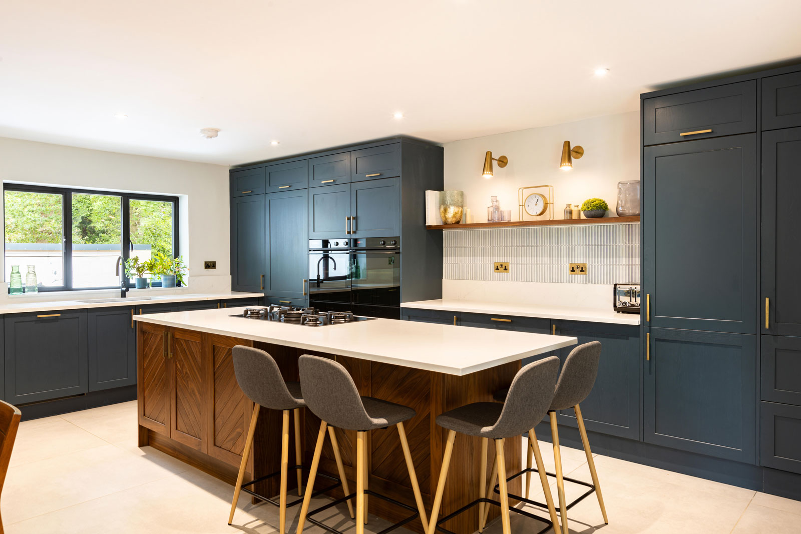 Luxury darrk blue wood kitchen with large island desgned by BKB kitchen designers